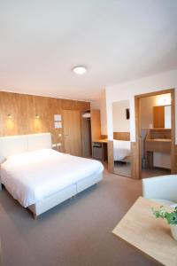 Ένα ή περισσότερα κρεβάτια σε δωμάτιο στο Hotel Chamdor