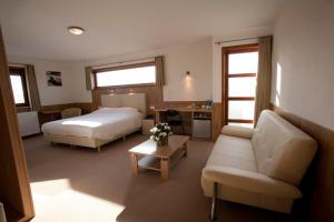 Ένα ή περισσότερα κρεβάτια σε δωμάτιο στο Hotel Chamdor