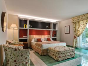 Postel nebo postele na pokoji v ubytování Hotel Hermitage
