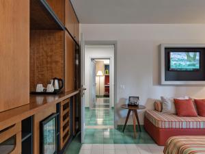 a living room with a couch and a table at Hotel Hermitage in Forte dei Marmi