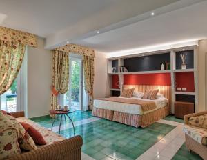 Postel nebo postele na pokoji v ubytování Hotel Hermitage + 37 fotografií