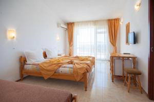 Postel nebo postele na pokoji v ubytování Stefanov 2 Hotel