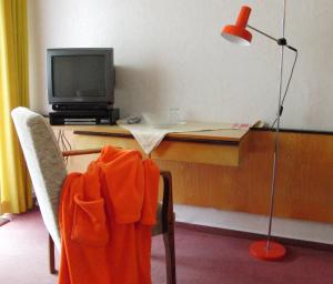 TV a/nebo společenská místnost v ubytování Hotel Olympia + 24 fotografií