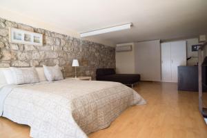 Posteľ alebo postele v izbe v ubytovaní Urbi Apartments