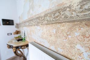 チヴィダーレ・デル・フリウーリにあるCasa Morganaの漆喰壁の部屋