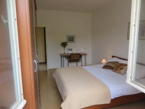 Ein Bett oder Betten in einem Zimmer der Unterkunft Gianna Apartment Labin