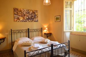 Posteľ alebo postele v izbe v ubytovaní Bed & Tours Dimora di campagna