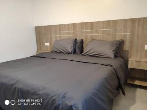 מיטה או מיטות בחדר ב-Union Amicale Corse Dakar