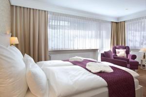 Postel nebo postele na pokoji v ubytování Hotel Garni Fürst von Waldeck