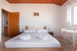 Postel nebo postele na pokoji v ubytování Guest House Town Center