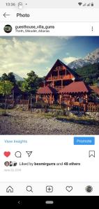 a screenshot of a picture of a log cabin at Guesthouse Villa Gurra in Theth