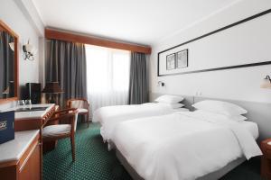 Postel nebo postele na pokoji v ubytování Hotel Z Palace & Congress Center