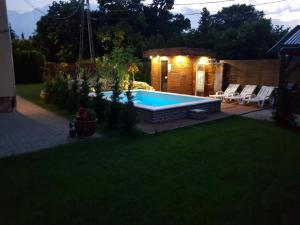 The swimming pool at or close to Sunrise Apartmanház