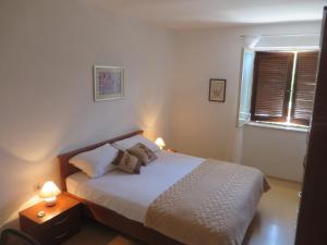 Ein Bett oder Betten in einem Zimmer der Unterkunft Gianna Apartment Labin