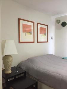 מיטה או מיטות בחדר ב-Zona Dorada Mazatlan
