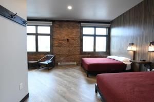 Postel nebo postele na pokoji v ubytování Crosby Lofts