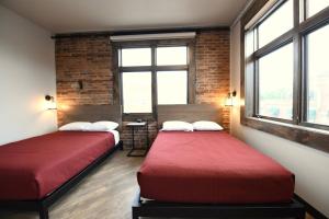 Postel nebo postele na pokoji v ubytování Crosby Lofts