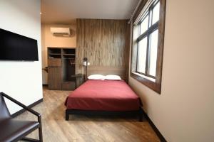 Postel nebo postele na pokoji v ubytování Crosby Lofts