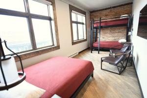 Postel nebo postele na pokoji v ubytování Crosby Lofts