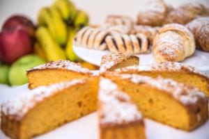a table topped with bread and other fruits and vegetables at Ischia Dream Sunset in Ischia