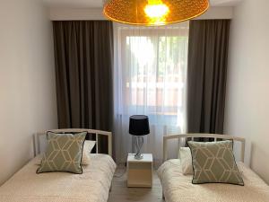 Гостиная зона в Apartament Zacisze Rose Gold