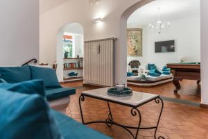 a living room with a couch and a table at Ischia Dream Sunset in Ischia