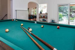 a billiard room with a pool table with balls at Ischia Dream Sunset in Ischia