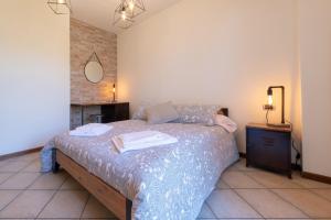 Un ou plusieurs lits dans un hébergement de l'établissement Villa dei Venti - Comfort Holiday
