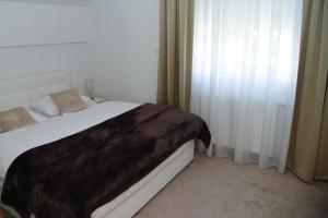 Postel nebo postele na pokoji v ubytování Apartman Livno