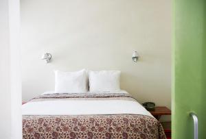 Postel nebo postele na pokoji v ubytování Hotel San Jose