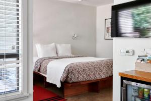Postel nebo postele na pokoji v ubytování Hotel San Jose