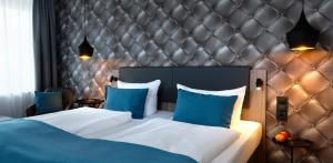 Postel nebo postele na pokoji v ubytování Trend Hotel
