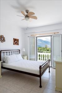 
Ένα ή περισσότερα κρεβάτια σε δωμάτιο στο Pernari Apartments
