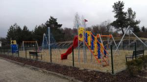 a park with a playground with a slide and slides at Megan turystyka in Gdańsk