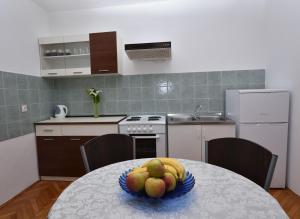 Kuchyň nebo kuchyňský kout v ubytování Apartments Katica