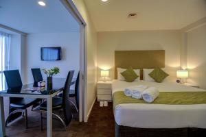Cama o camas de una habitación en The Quadrant Hotel & Suites
