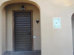 a front door of a house with a picture on the wall at Azienda Agrituristica Bocci in Gualdo Tadino