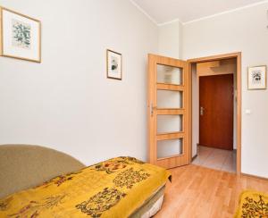 Posteľ alebo postele v izbe v ubytovaní Apartament w Sercu Starówki