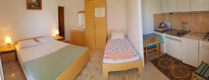 Posteľ alebo postele v izbe v ubytovaní Apartments Butkovic