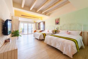 Una cama o camas en una habitación de Mong Shan Homestay