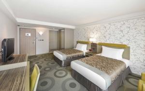 Postel nebo postele na pokoji v ubytování Fullon Hotel Kaohsiung