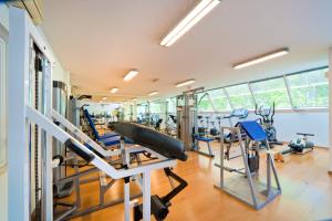 a gym with treadmills and exercise equipment in a building at Camping Lido in Lazise