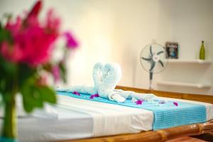 Postel nebo postele na pokoji v ubytování Lunazul Guesthouse + 35 fotografií