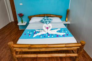 Postel nebo postele na pokoji v ubytování Lunazul Guesthouse