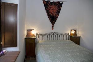Postel nebo postele na pokoji v ubytování B&B BOSCOVECCHIO