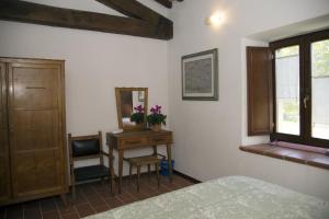 Postel nebo postele na pokoji v ubytování B&B BOSCOVECCHIO