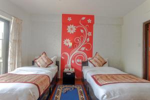 Postel nebo postele na pokoji v ubytování Hotel Peace Plaza