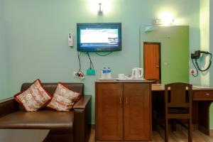 TV a/nebo společenská místnost v ubytování Hotel Peace Plaza