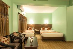 Postel nebo postele na pokoji v ubytování Hotel Peace Plaza