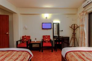 Postel nebo postele na pokoji v ubytování Hotel Peace Plaza